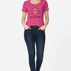 Woman wearing a pink t-shirt with a graphic and text on a pink background