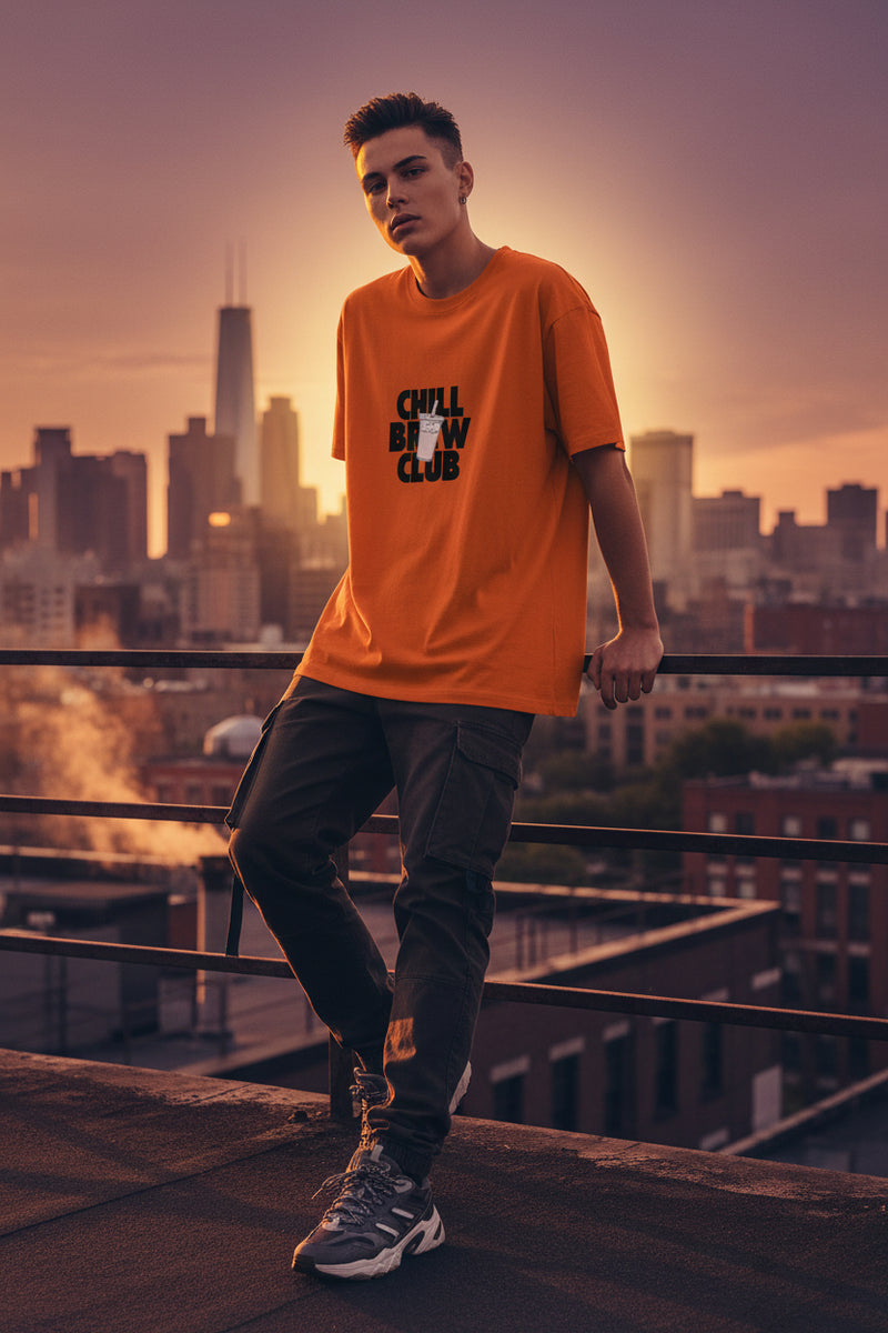 Orange t-shirt with 'Chill Brew Club' text and graphic on a white background