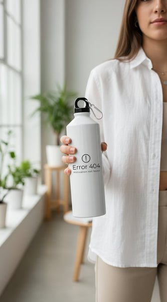 White water bottle with geometric design on a light surface with greenery in the background