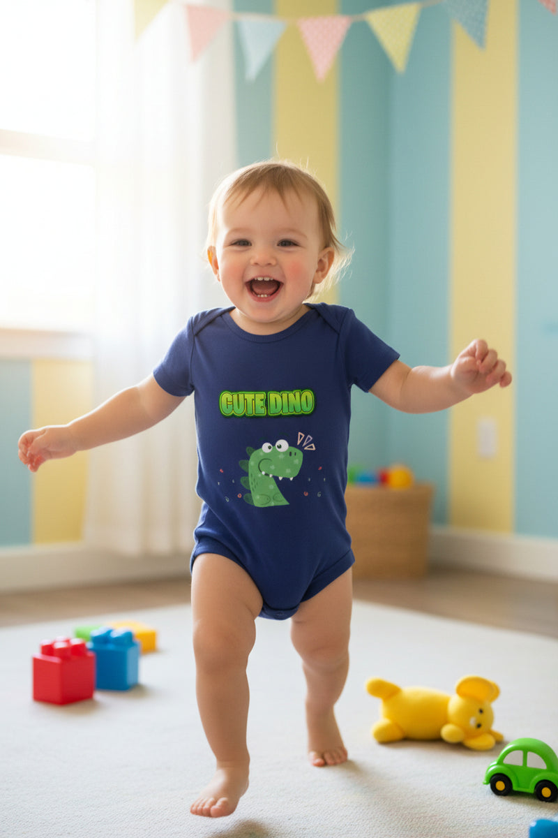 Navy blue baby onesie with green dinosaur graphic and 'Cute Dino' text on a white background