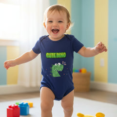 Navy blue baby onesie with green dinosaur graphic and 'Cute Dino' text on a white background