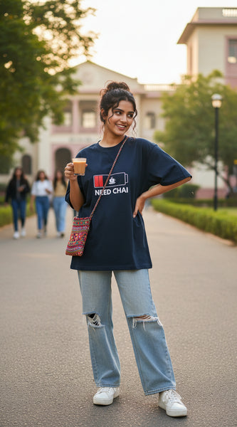 Blue  t-shirt with a graphic design and text 'NEED CHAI' on a white background