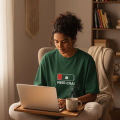 Green t-shirt with 'Need Chai' graphic on a white background