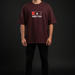 Brown t-shirt with 'NEED CHAI' graphic on a white background