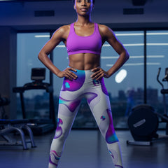 Colorful abstract-patterned leggings on a person against a white background