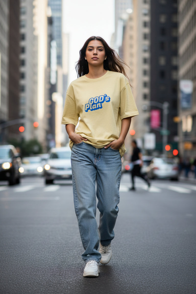 Yellow t-shirt with 'GOD's Plan' text on a white background