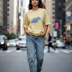 Yellow t-shirt with 'GOD's Plan' text on a white background