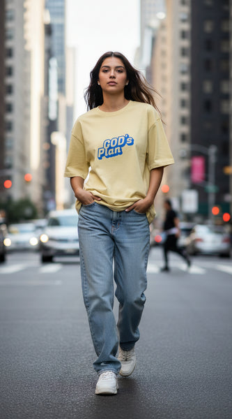 Yellow t-shirt with 'GOD's Plan' text on a white background