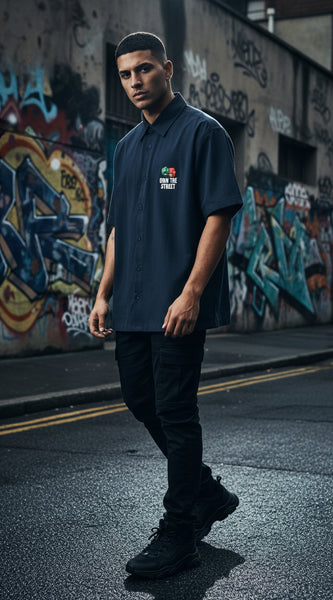 Blue  shirt with graphic design and text on a white background