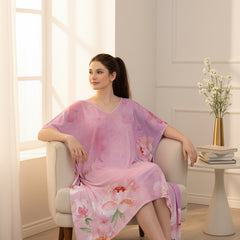 Woman wearing a pink floral dress on a white background