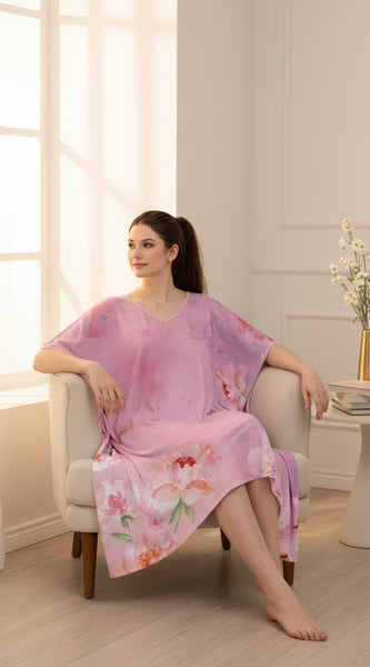 Woman wearing a pink floral dress on a white background