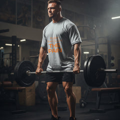 Gray t-shirt with 'Push Through The Pain' text in orange on a white background