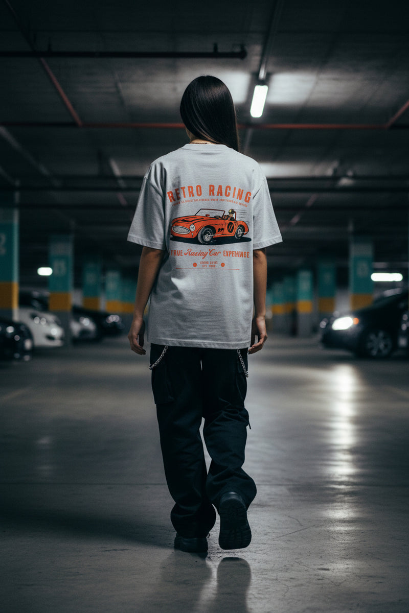 Gray t-shirt with a red and orange vintage car graphic and text on a white background