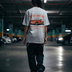 Gray t-shirt with a red and orange vintage car graphic and text on a white background