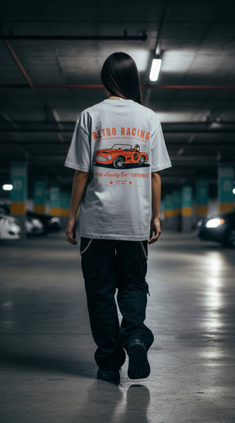 Gray t-shirt with a red and orange vintage car graphic and text on a white background