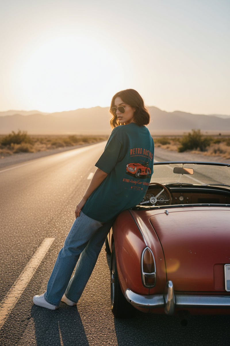 Teal t-shirt with retro racing graphic on a white background