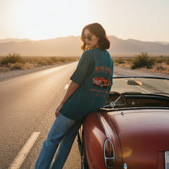 Teal t-shirt with retro racing graphic on a white background