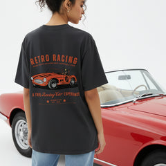 Black t-shirt with retro racing car graphic on a white background