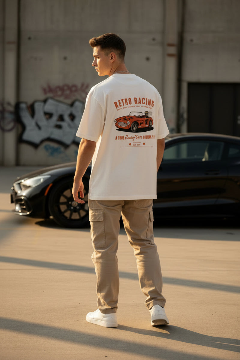 White t-shirt with a retro racing car graphic and text on a white background