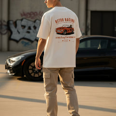 White t-shirt with a retro racing car graphic and text on a white background