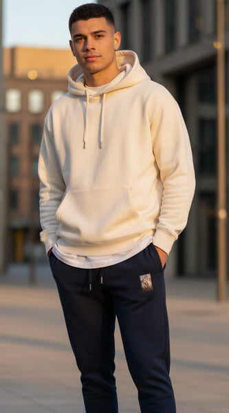 Blue jogger pants with a small logo on a white background