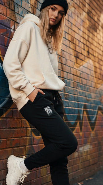 Black sweatpants with 'AETHIC' logo on a white background