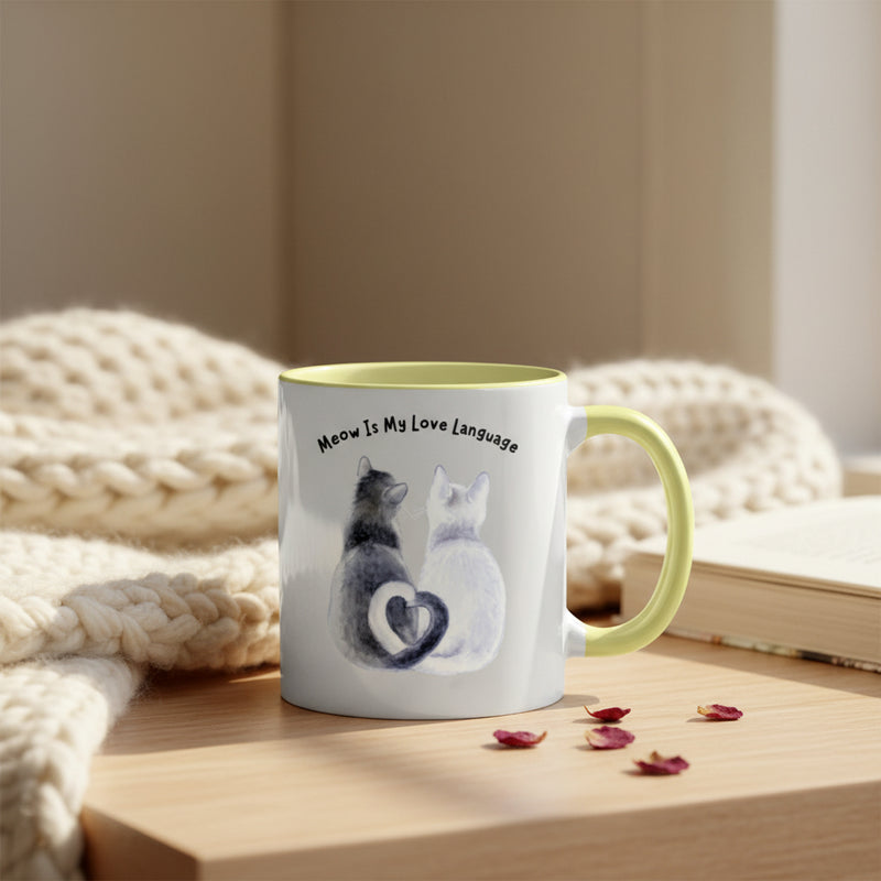 Mug with cat design and text 'Meow is my love language' on a pink background