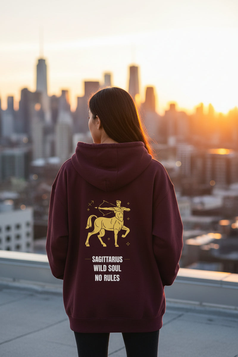 Maroon hoodie with Sagittarius zodiac design on the back against a white background