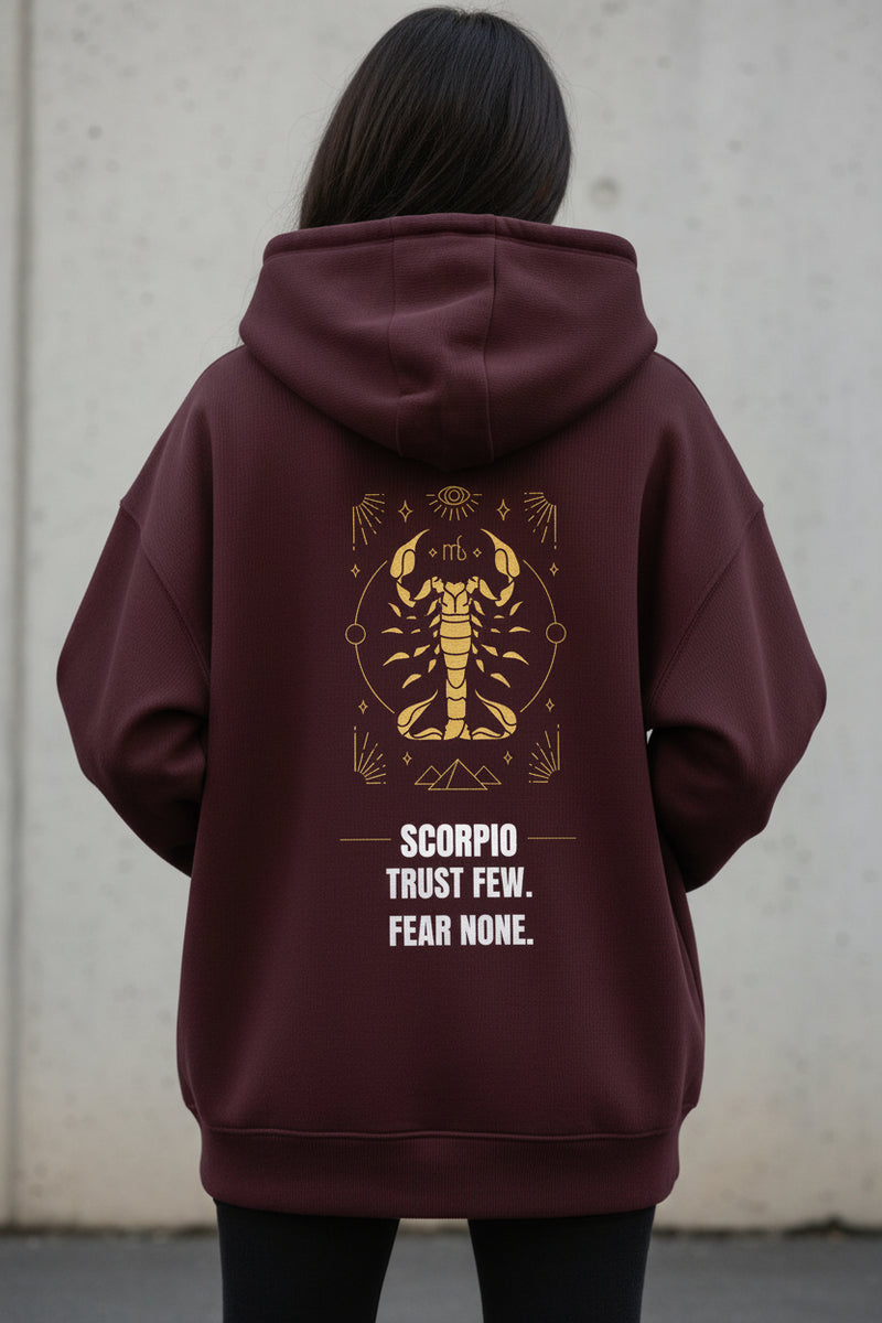 Maroon hoodie with Scorpio zodiac design and text on a white background