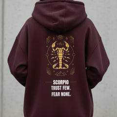 Maroon hoodie with Scorpio zodiac design and text on a white background