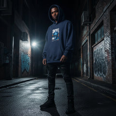 Person wearing a blue hoodie with visible branding in an urban alleyway.