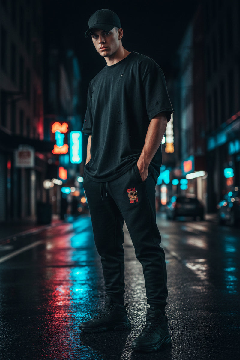 Black sweatpants with a small logo on a white background