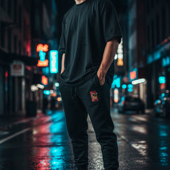 Black sweatpants with a small logo on a white background