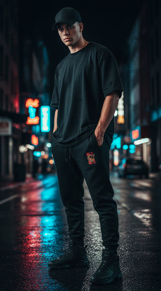 Black sweatpants with a small logo on a white background