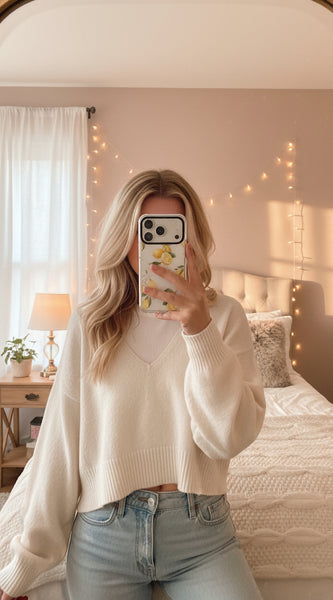 Phone case with lemon design on a light gray background