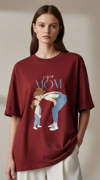 Woman wearing a Red  t-shirt with a graphic design and text on a plain background