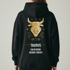 Black hoodie with Taurus zodiac design on the back against a white background