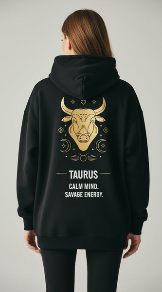 Black hoodie with Taurus zodiac design on the back against a white background