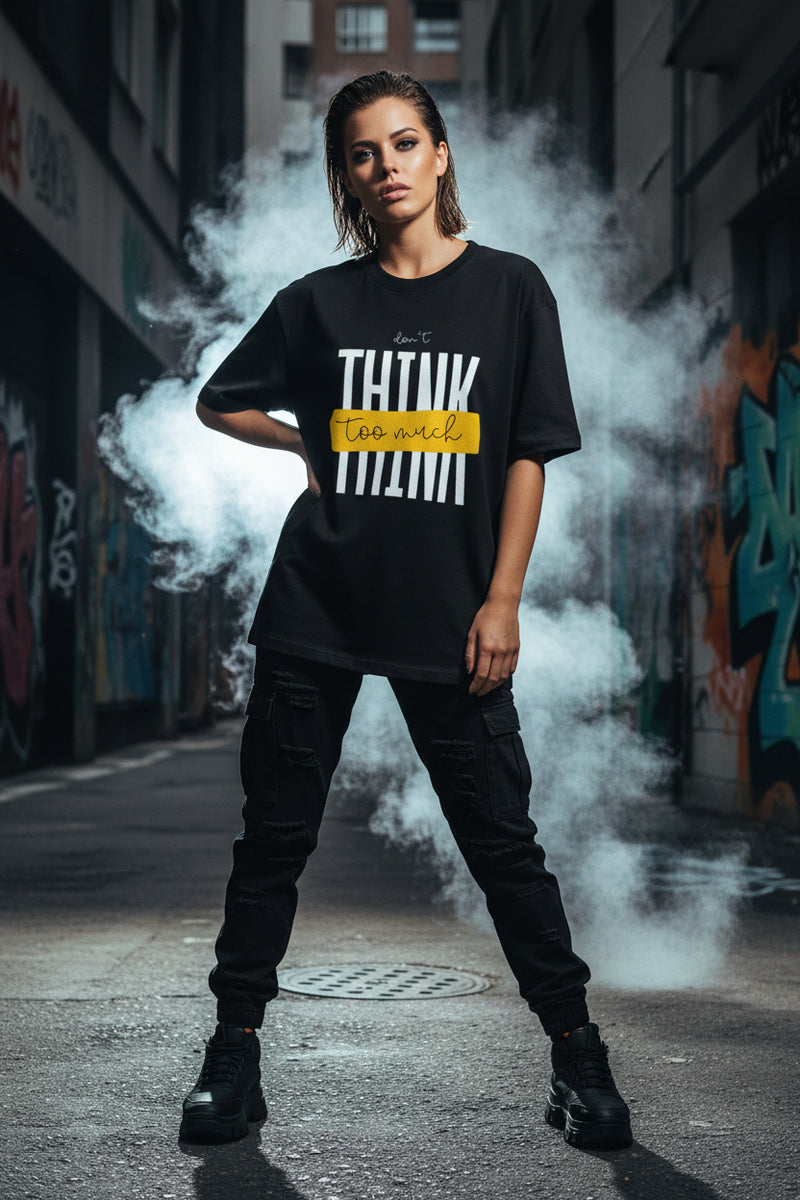 Black t-shirt with white text and yellow box on a white background