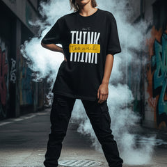 Black t-shirt with white text and yellow box on a white background
