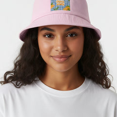 Pink bucket hat with a colorful patch on a white background