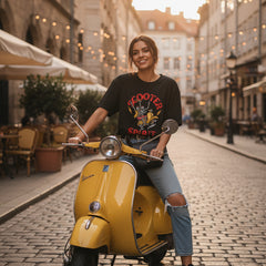 Black t-shirt with a graphic design of a skeleton on a scooter and text 'Scooter Spirit' on a white background.