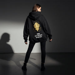 Black hoodie with gold and white graphic and text on a light gray background