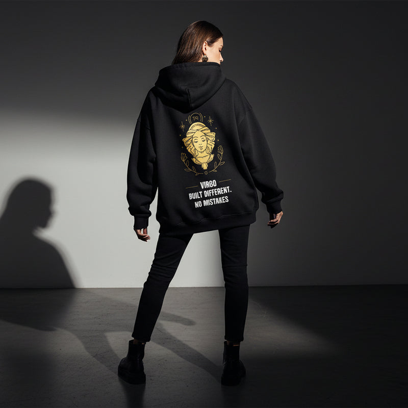 Black hoodie with gold and white graphic and text on a light gray background