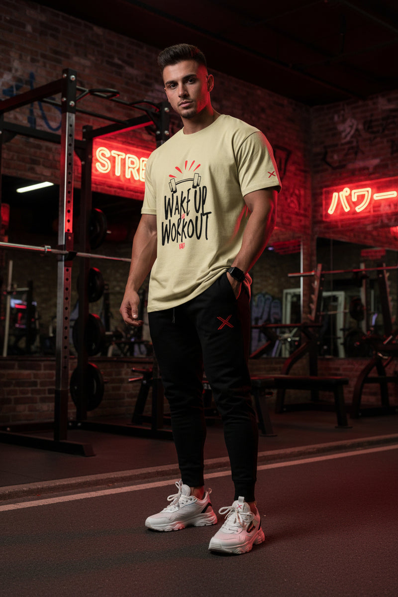 Beige t-shirt with 'Wake Up Workout' text and graphic on a white background