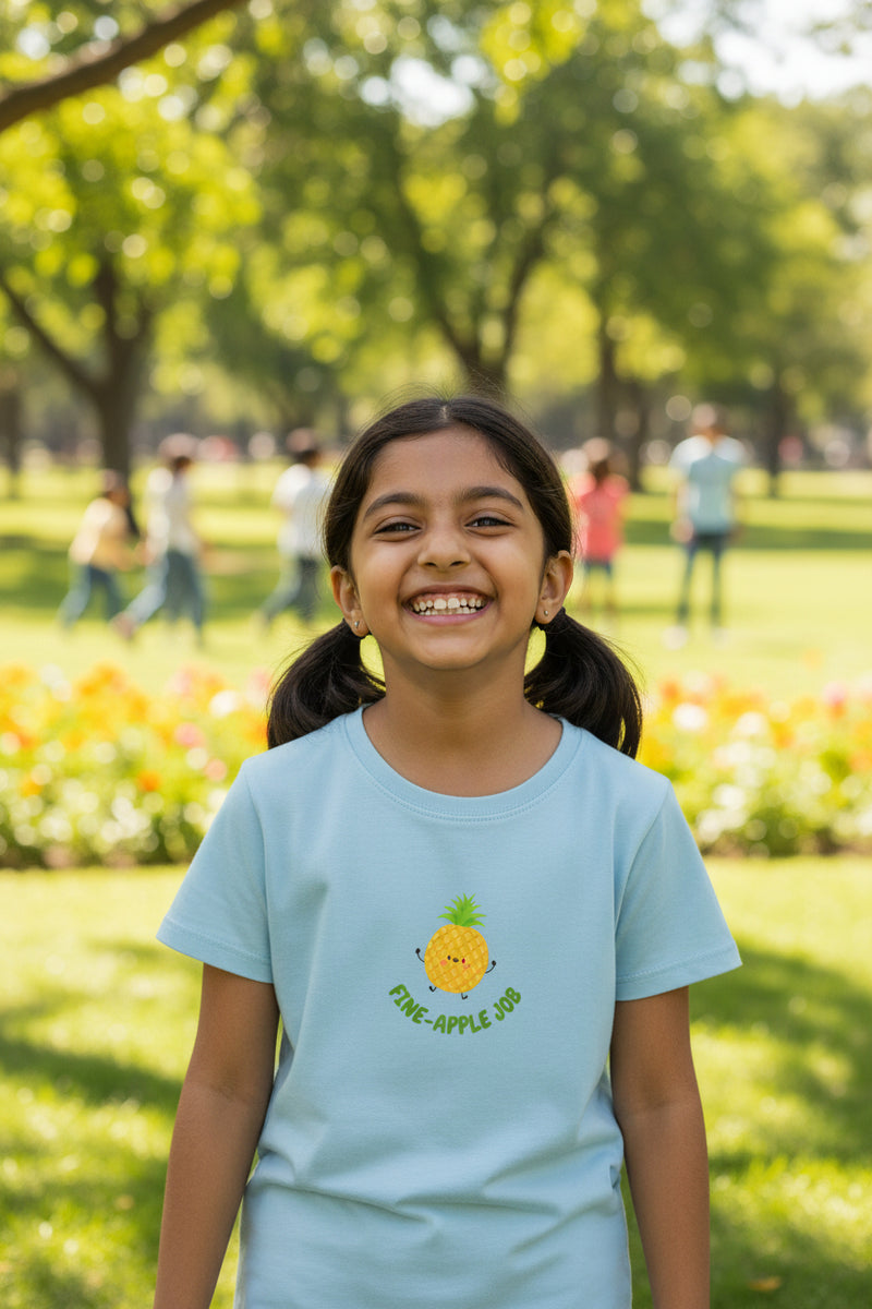 White t-shirt with a pineapple graphic and text on a white background