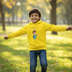 Child wearing a yellow hoodie with a cartoon character on a white background